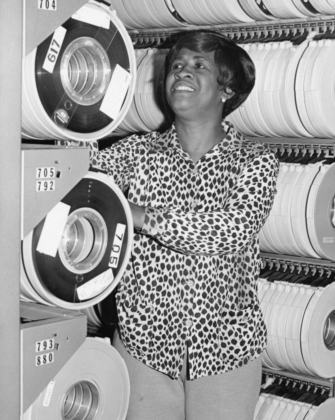 Archivist reviewing film reels